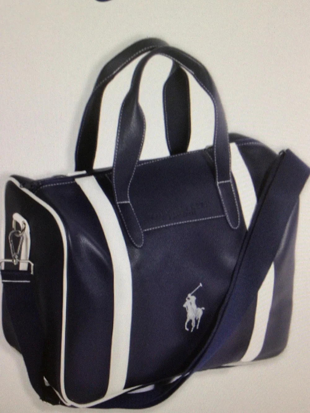 Dark blue PU leather handbag for short trips.